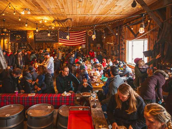 Room filled with visitors enjoying maple syrup